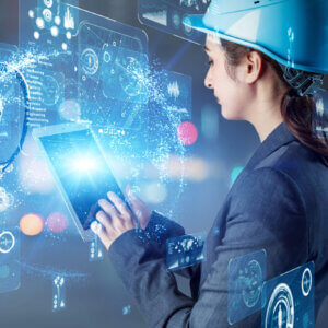Woman in a hardhat on an iPad