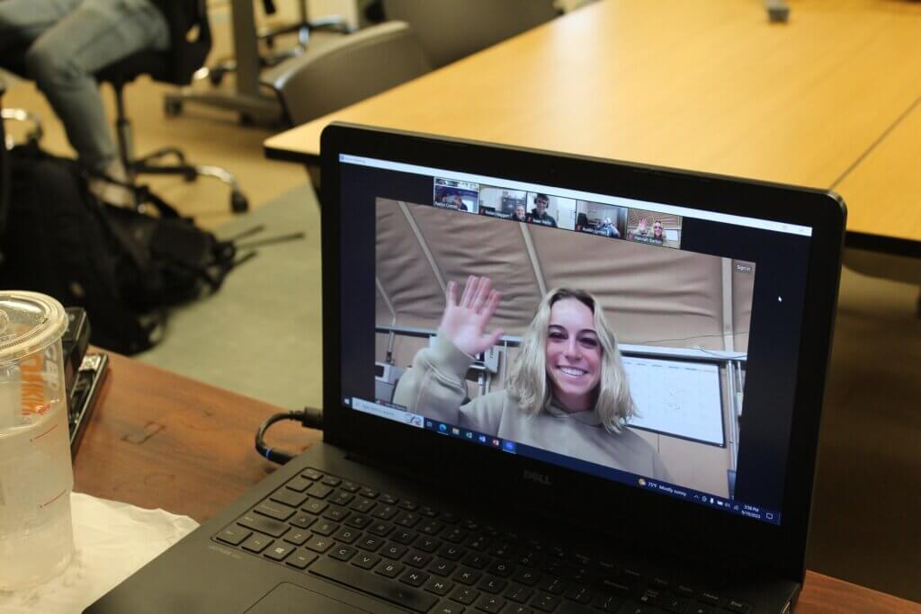 Face of a student on a laptop dialing into a class remotely