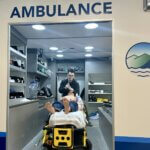 EMT student practicing on a dummy in the LRCC demo ambulance