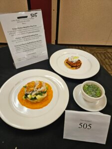 Display of student entries in SkillsUSA competition: crispy chicken medallion pita crisp; chicken, spinach and dumpling soup; and herb goat cheese-stuffed chicken roulade