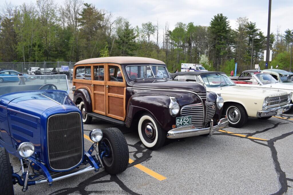 Row of classic cars - one has wooden doors and side panels