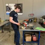Student working on a weedwhacker as part of SkillsUSA