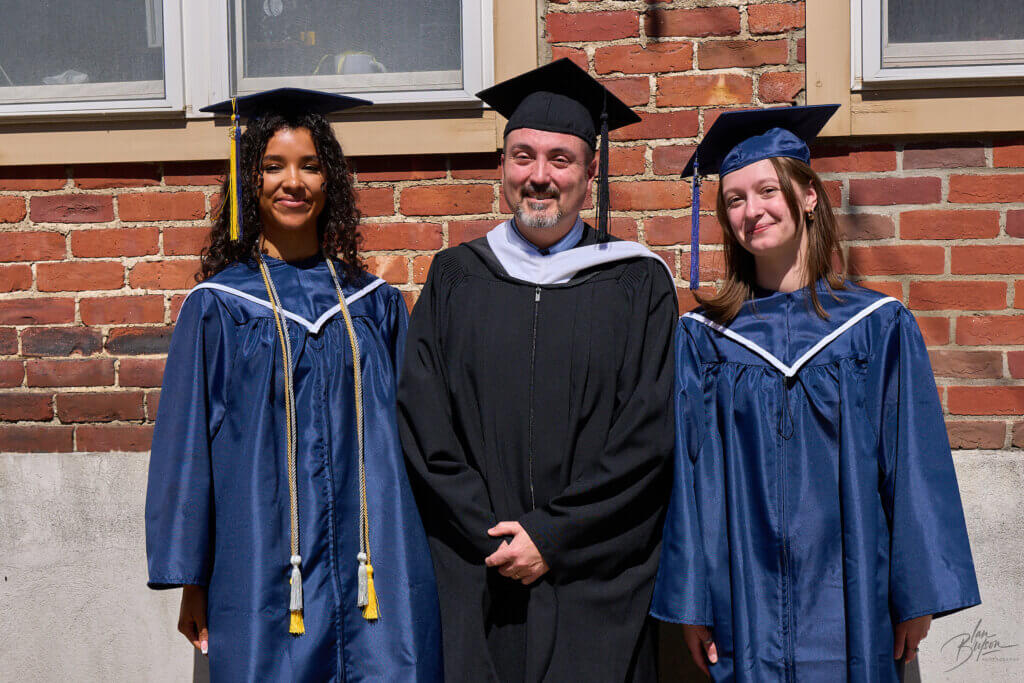 Graduates with faculty member 2026