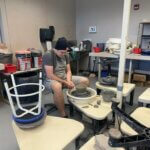 Student at pottery wheel