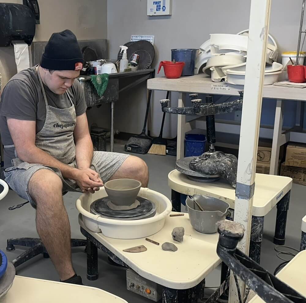 Student at pottery wheel