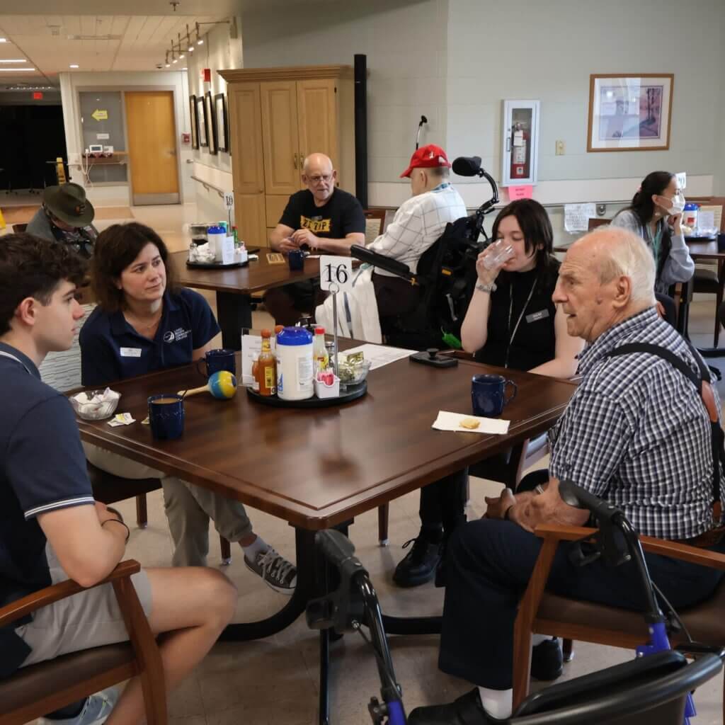 Staff visiting NH Veterans Home for Coffee Social