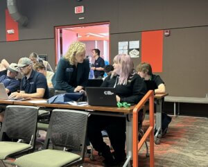 Melissa Ballard works with a student at orientation