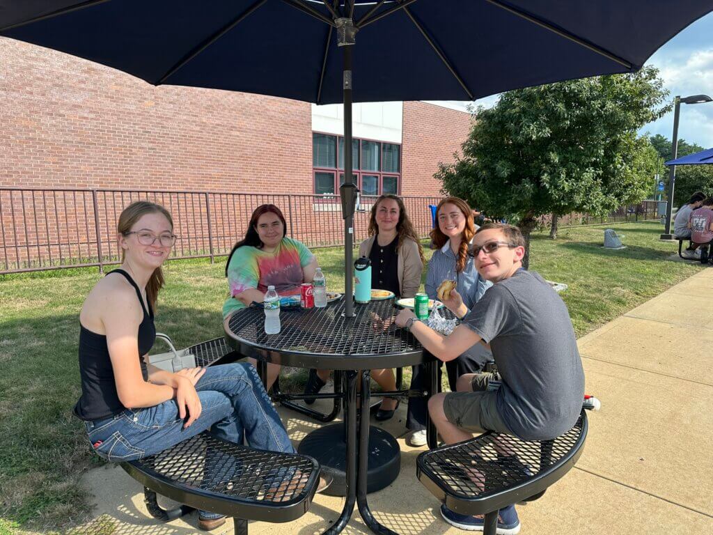 Students at table outside