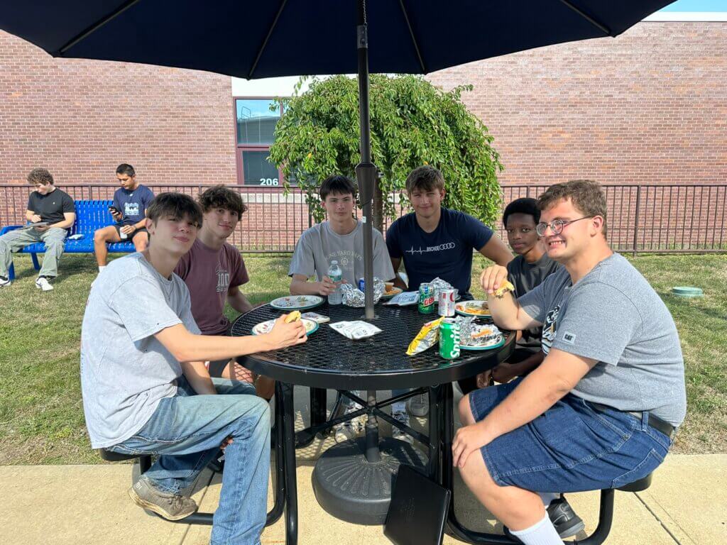 Students at table outside